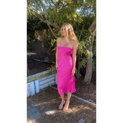 Bec and Bridge Moondance Midi Dress in Hot Pink, Size 6 and 10. Perfect for events like formals, 21sts, races etc. Silky/Satiny feel slight flow to dress. Front side full length view of dress. 