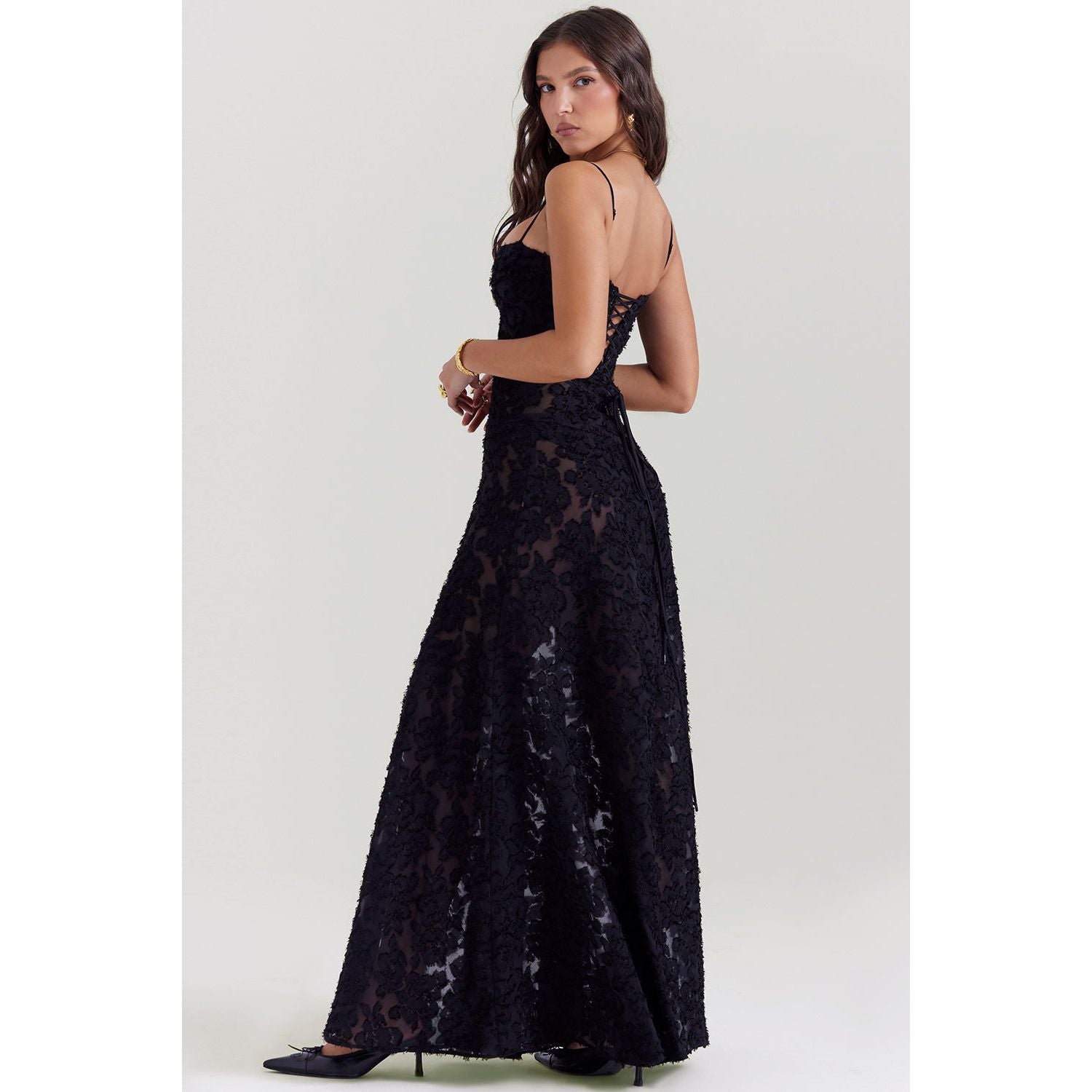 House of CB Seren Maxi Dress in Black, Size XS and L. Perfect for formal events. Lace up back and zip at bottom of lace up.. Semi sheer fabric with a doubled lined bust. Back side full length view of dress