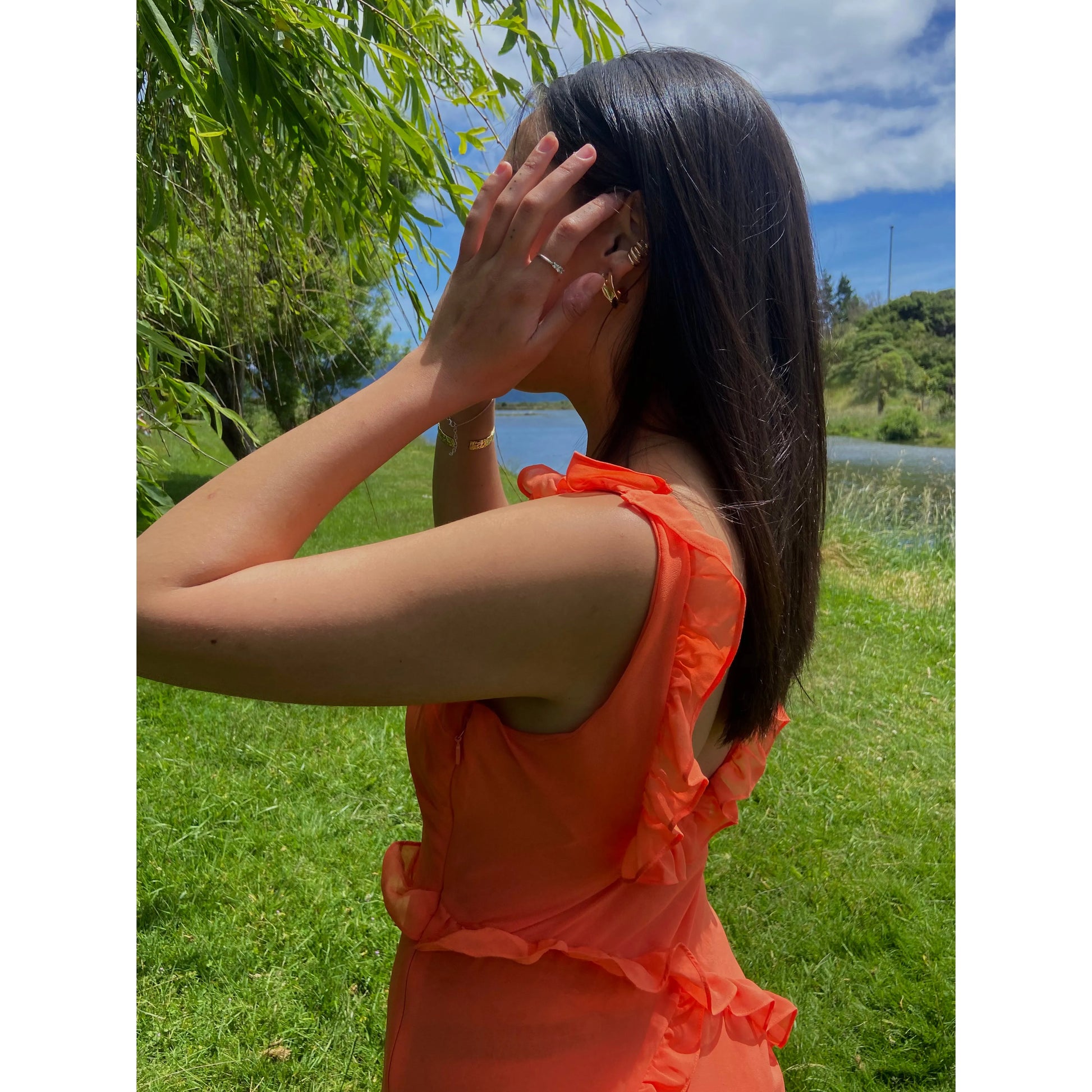 House of CB Pixie Maxi Dress in Flame, Size S. Featuring straps with a v cut into the bust and some frill details on the dress. Perfect for formals, races, wineries, bottomless brunch etc. Zip up side. Side up close  view of dress