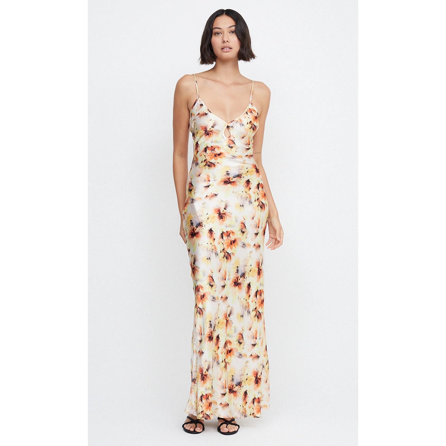 Bec and Bridge Cedar City in Sunset Floral Shade, Size 14. Open back with adjustable straps/back of bust area. Perfect for formal events. Made of viscose and ecovero. Front on full length view of dress.