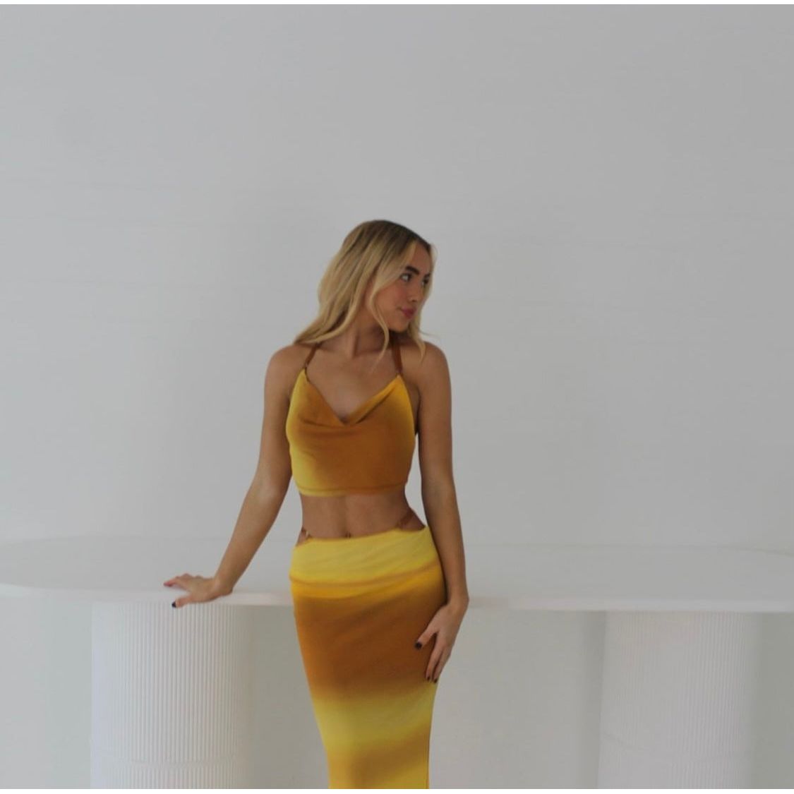 Bec and Bridge Amara Set in Ombre Yellow/Mustard, Size 6.  Adjustable top at back and skirt with zip. Perfect for summer events with a semi tight fit and breathable fabric. Front on view of set not full length picture ends around knee height