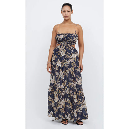 Bec and Bridge Alexandra Tie Maxi Dress, Size 16. Navy with some floral patterning that is cream/light brown. Thin flowy material. Small stomach cut outs on the side. Slightly adjustability at back and very stretchy. Front on view of dress