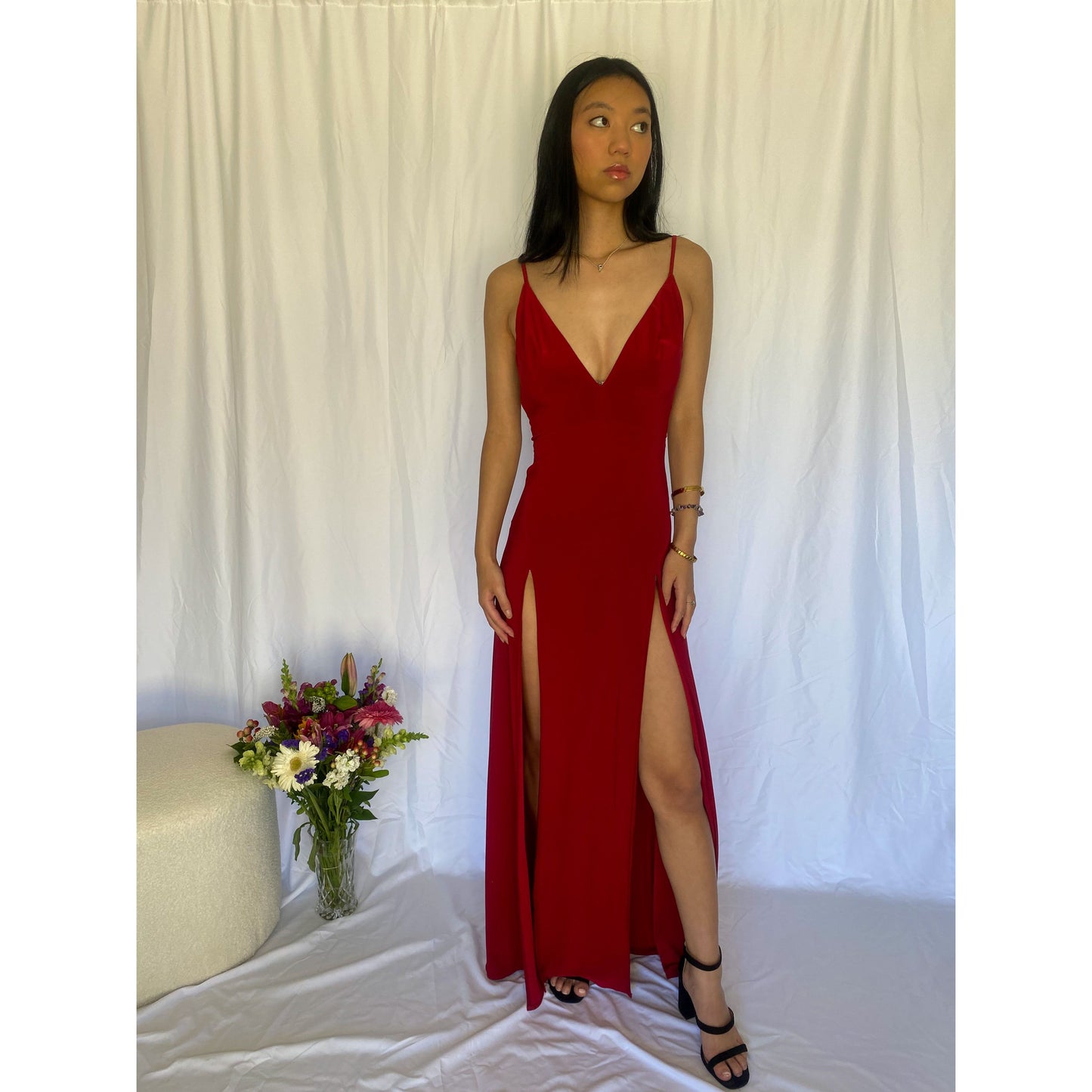 Abbys by Abbey Elle Gown in Red, Size 6/XS. Open back with low cut front an two slits coming up each front side of the dress ending at mid thigh. Perfect for formal events. Front full length view of dress.