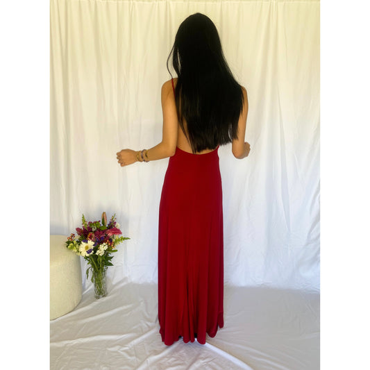 Abbys by Abbey Elle Gown in Red, Size 6/XS. Open back with low cut front an two slits coming up each front side of the dress ending at mid thigh. Perfect for formal events. Back view of dress.