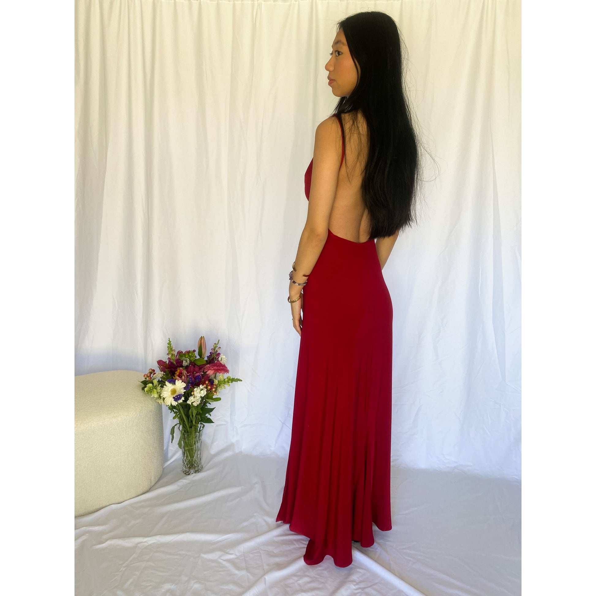 Abbys by Abbey Elle Gown in Red, Size 6/XS. Open back with low cut front an two slits coming up each front side of the dress ending at mid thigh. Perfect for formal events. Back side view of dress.