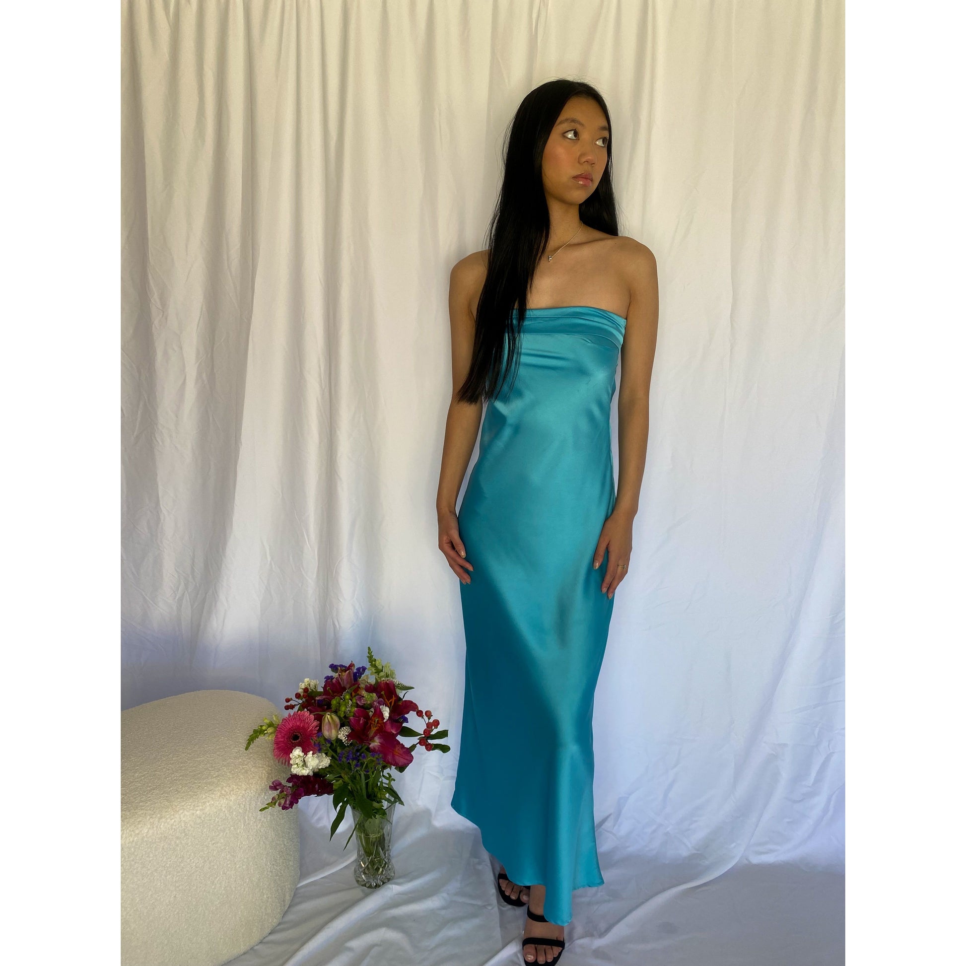 Miya Maxi in Turquoise Blue, Size 8/S. Strapless design with a tight yet flowy satiny material with a zip up side. Perfect for races, graduation, formals etc. Front on full lenght view of dress.