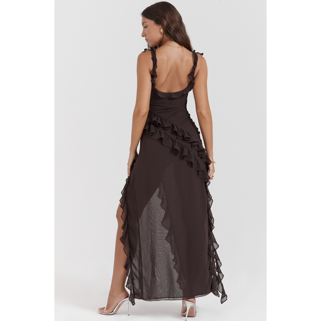 House of CB Ariela Maxi in Brown, Size M. Made of lightweight georgette fabric. Perfect for formal events. Featuring a zip up side and leg slit to mid thigh. Back full length view of dress.