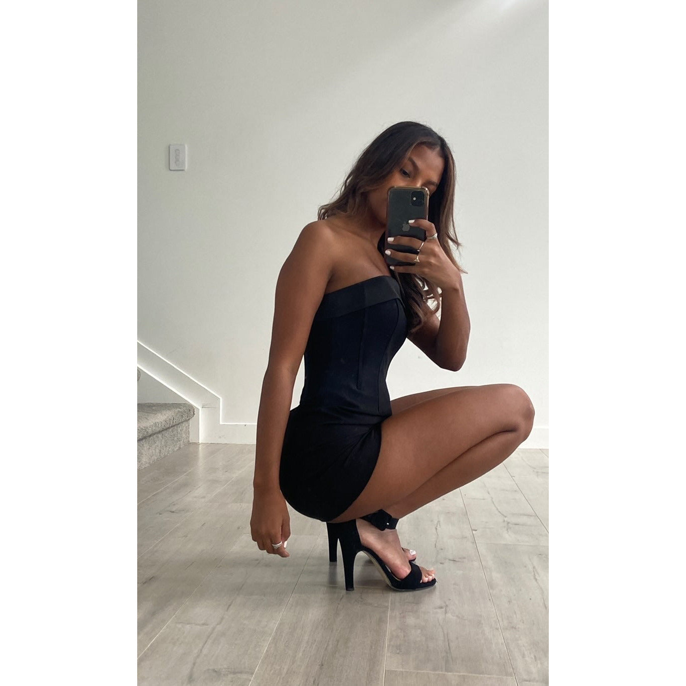 With Jean Chloe Corset Mini in Black, Size 6. The perfect LBD featuring a figure hugging corset fit with a zip up back. This is perfect for birthdays, bottomless brunches etc. Side view off dress.