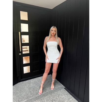 With Jean Chloe Corset Mini in White, Size 8. Featuring a figure hugging corset fit with a zip up back. This is perfect for birthdays, bottomless brunches etc. Front on view off dress.