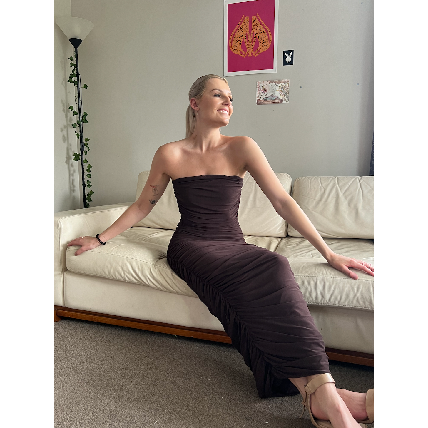 Ruby Ginni Mesh Tube in Chocolate Brown, Size 8. Featuring a strapless design with gathered side seams that create ruching that gently accentuate the contours of your silhouette. Perfect for formals, weddings, races, wineries, birthdays etc. Front on sitting down view of dress.