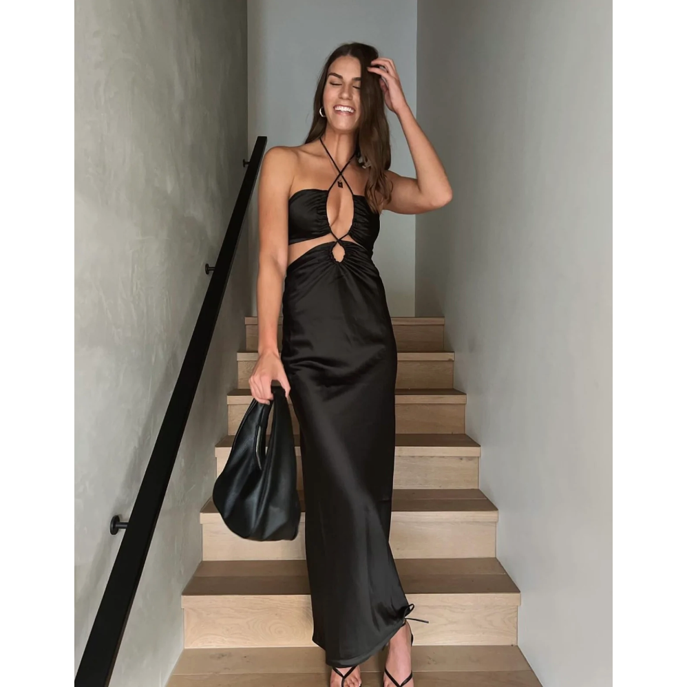 Jagger and Stone Ruby Maxi in Black, Size 6. Has intersecting front pieces with the bust piece attached to the skirt area by strings that can be tightened. Zip on back of dress skirt area. Best suited for formal events.