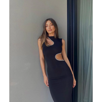 Ivona Skelo Vivia Dress in Black with Crystal Cut Outs, Size 8/S. Featuring two cut outs one at the waist and one at opposite shoulder the edge of both cut outs is covered with crystals. Perfect for formal events. Front on view of dress.