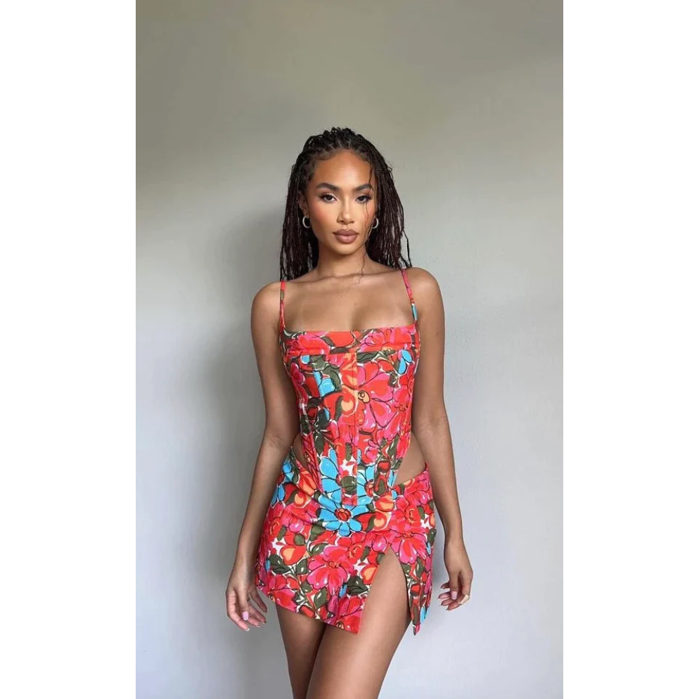 Miaou Parsian Flower Corset and Micro Mini Skirt Set, Size S. Colour scheme is pink, blue and red mostly. Featuring a lace up back and skirt which also has a small side split. This micro mini is very small. Top can be rented separately. Perfect for festivals, 18th's, bottomless brunch etc. Front on view of set.